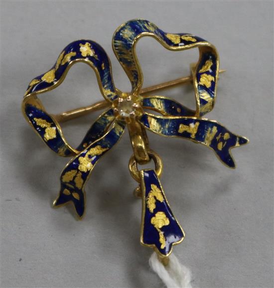 A late 19th century French 18ct gold, enamel and rose cut diamond set ribbon bow brooch, (enamel a.f.), 24mm.